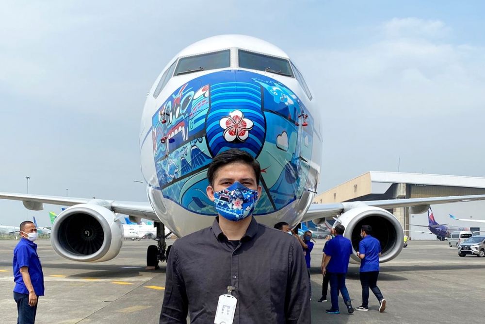 Desain Masker Jailani Putra Riau Terpampang di Pesawat Garuda Indonesia